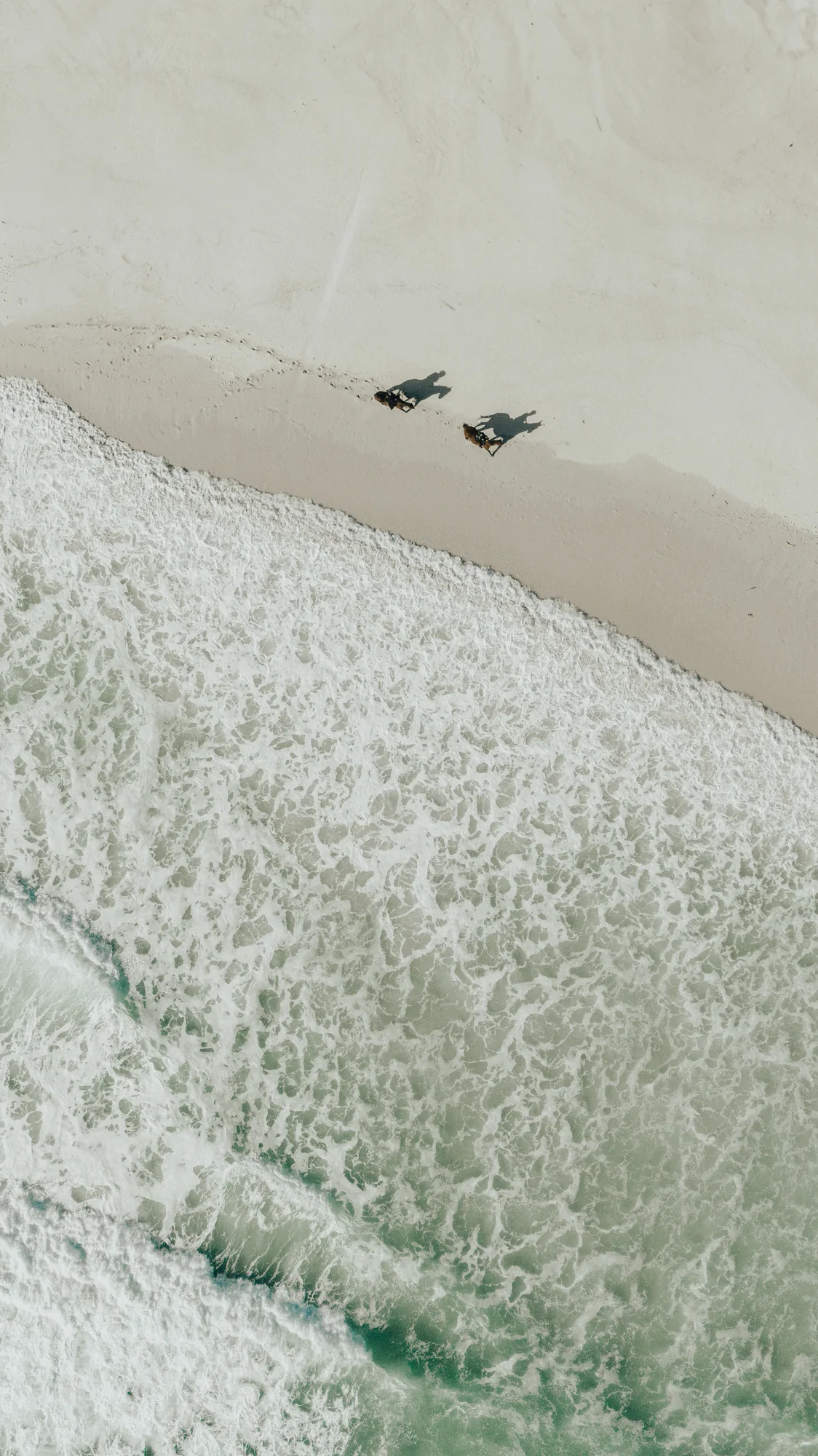 Aerial beach, two figures